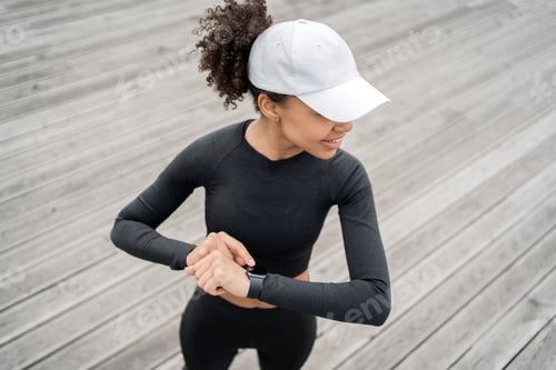 Preview: smart watch uses a sporty woman runner outdoor training, pulse and calories