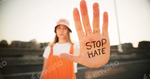 Preview: Hands, stop hate and equality for person with writing, sign and protest for racism, peace and inclu