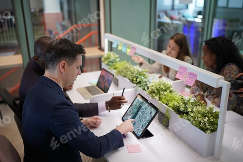 Preview: Diverse business people having a meeting