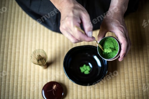 Preview: Japanese Tea Ceremony, man spooning green tea powder into bowl.