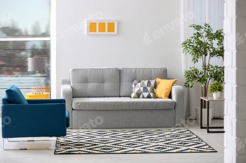 Preview: Stylish living room interior with comfortable sofa and armchair