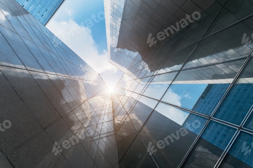 Preview: Low angle of modern skyscrapers against the blue sky