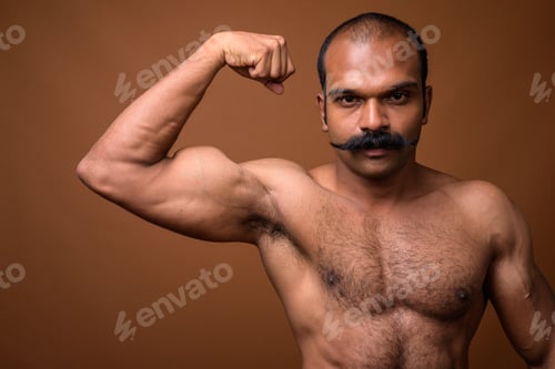 Preview: Portrait of muscular Indian man with mustache shirtless