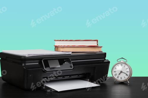 Preview: Home laser printer on desk against green background