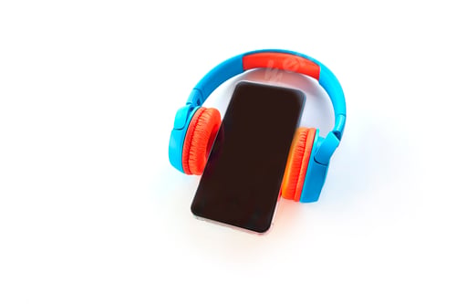 Preview: Smartphone with Blank Screen and Earphones Isolated on white background. Top view