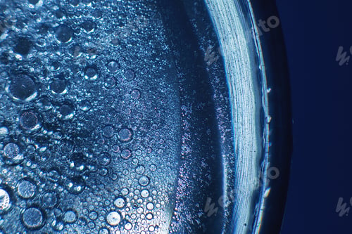 Preview: abstract light blue background with oil circles . bubbles of water close up