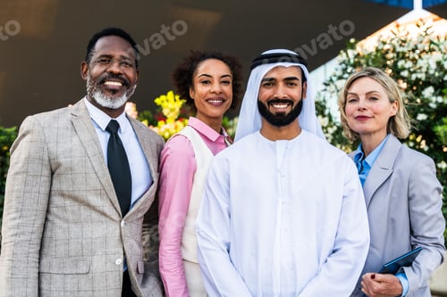 Preview: Group of multiethnic business people meeting an emirati businessman