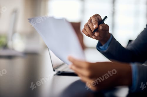 Preview: Close-up of a black female hands, holding some paper, doing a papyrology.