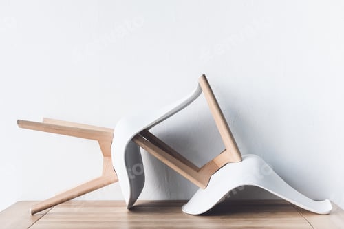 Preview: close up view of modern chairs on wooden tabletop