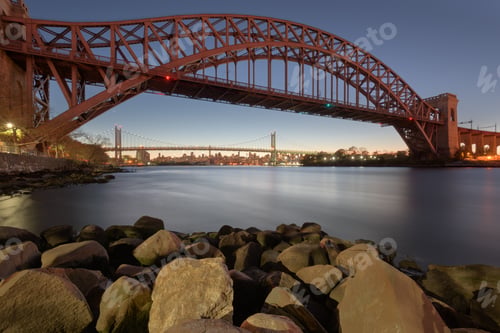 Preview: New York, New York, USA at Hell Gate Bridge at sunset over the East River