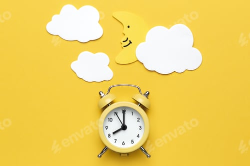 Preview: Yellow round alarm clock, moon and white clouds on the yellow background.