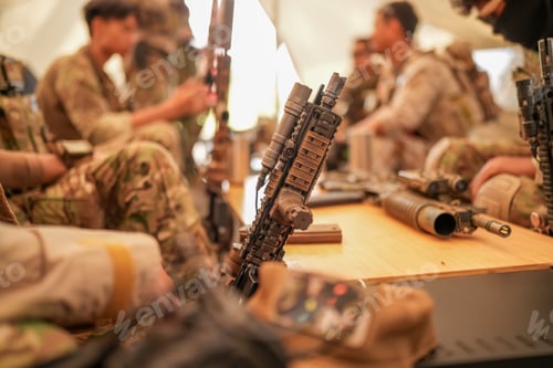 Preview: US Army Rangers group with weapons. army , planning strategy or teamwork