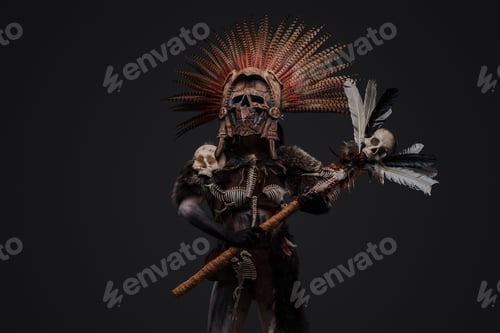 Preview: Ancient witch with plumed headdress and staff with skull