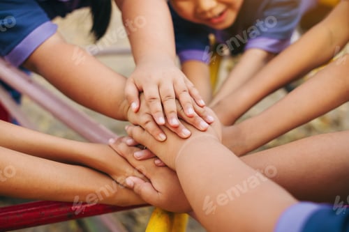 Preview: hands togetherness of kids for concept of teamwork