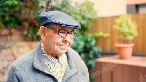 Preview: Distracted grandfather looking away in a nursing home