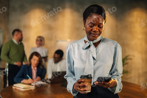Preview: Interracial manger using phone on meeting at boardroom.