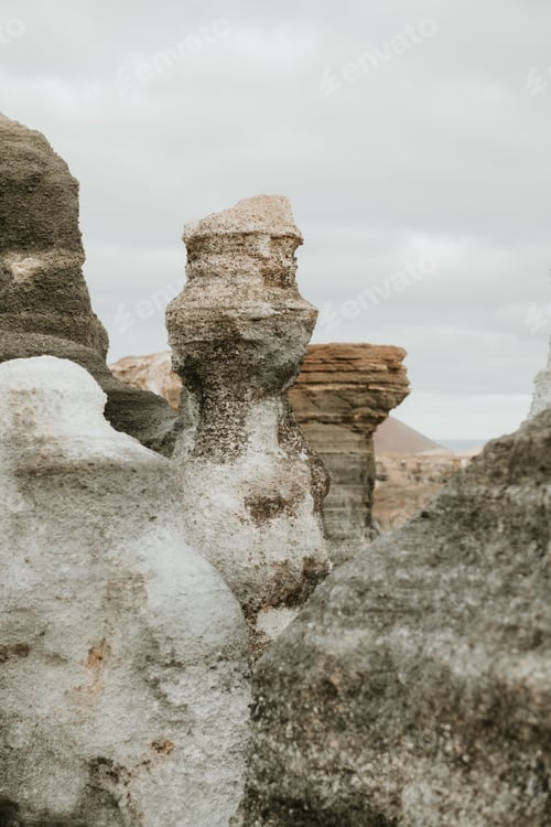 Preview: Cloudy sky over stone pillars