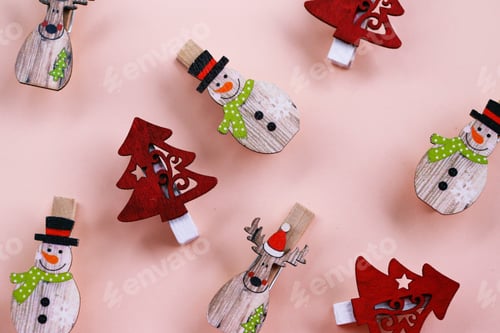 Preview: Christmas Decoration Clothespins on Pale Pink Background
