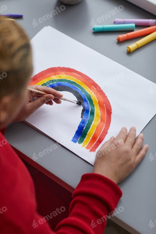 Preview: Mixed Race Woman Drawing Rainbow Close Up