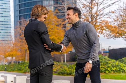 Preview: Middle-aged Caucasian businessman and executive,
shaking hands, good work environment