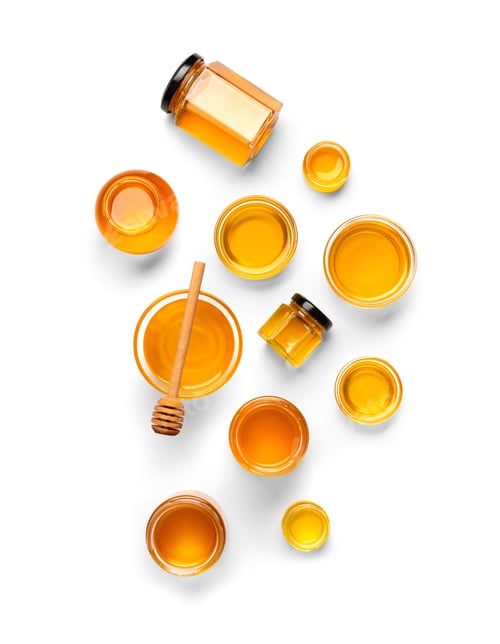 Preview: Composition from different jars with honey on isolation top view