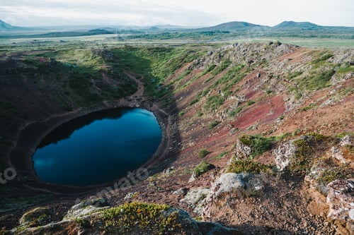 Preview: beautiful volcanic lake kerid and green hills in iceland
