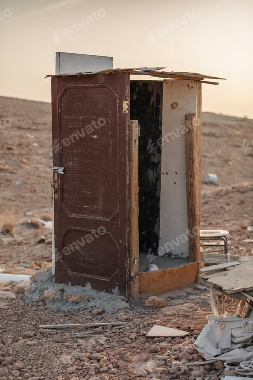 Preview: Old abandoned wooden outhouse in the desert