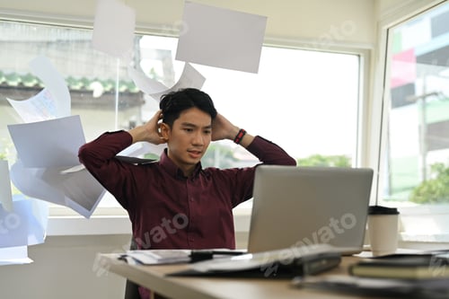 Preview: Image of stressed man office worker feeling distressed anxious with work deadline.