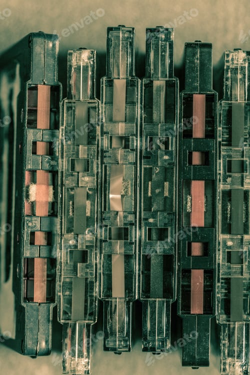 Preview: Classic pile of old cassette tape on wooden table