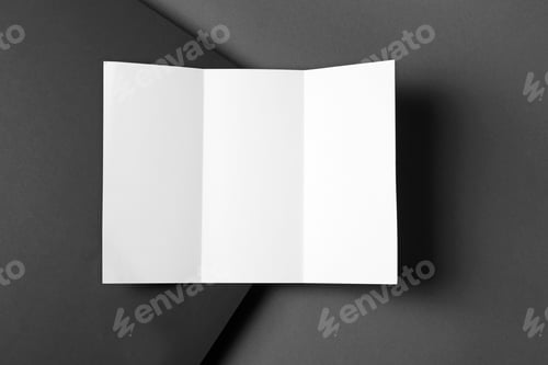 Folded White Paper on Dark Gray Background