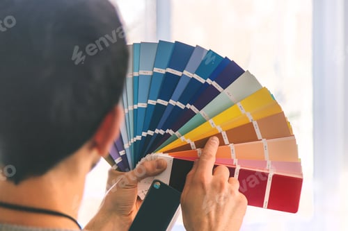 Preview: Repair work to select the color of the paint on the palette. Selective focus.