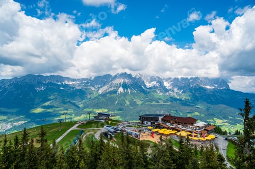 Preview: A scenic view of a mountain resort with a dramatic sky