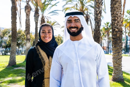 Preview: Traditional arab couple wearing emirati clothing dating outdoors