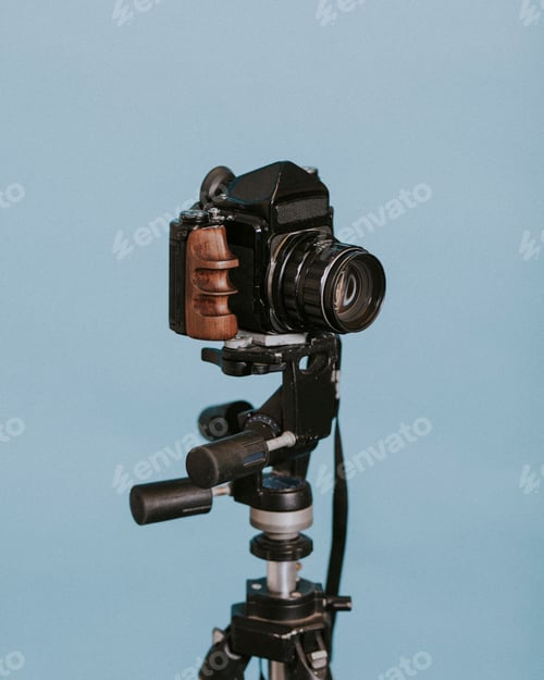 Preview: Vintage camera against blue backdrop
