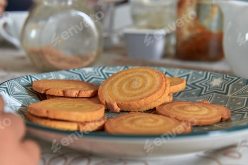 Preview: elementary age boy eating cookies on breakfast table