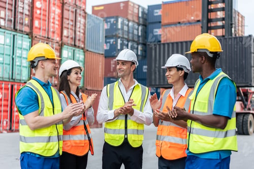 Preview: Group of man and woman worker clap hands while work in container port.