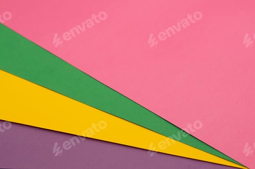 Preview: Multi colored paper background of pink, green, yellow and purple.