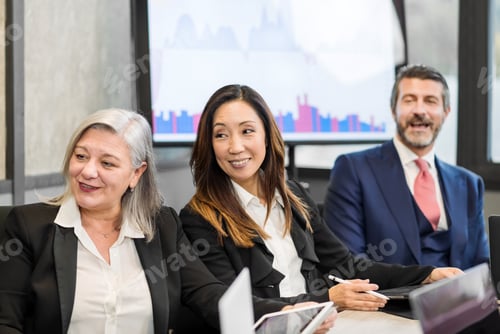 Preview: Diverse businesspeople enjoying meeting in office