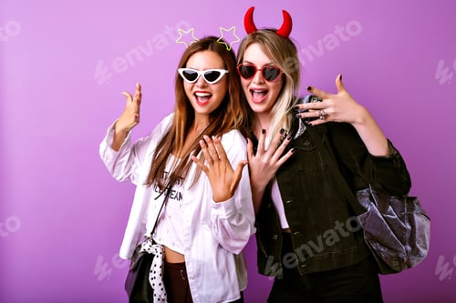 Preview: Young funny girls making selfie at studio making grimaces and going crazy
