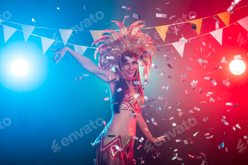Preview: Carnival, belly dance and holiday concept - Beautiful female samba dancer wearing gold costume and