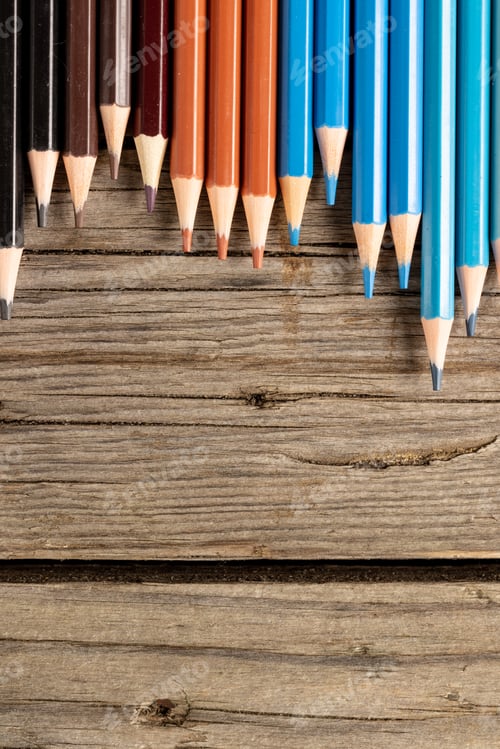Preview: Composition of colorful crayons on wooden background