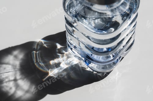 Preview: Sunlight on plastic bottle of water