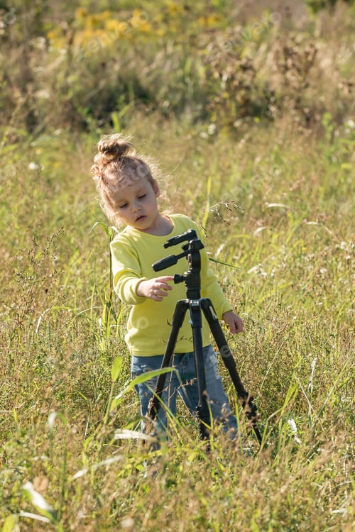 Preview: little girl on a walk in the warm season