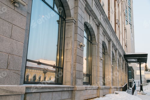 Preview: Street with building cold weather. Snow day in winter. Building in city center covered with snow.