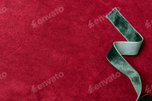 Preview: Velvet green ribbon on a red background