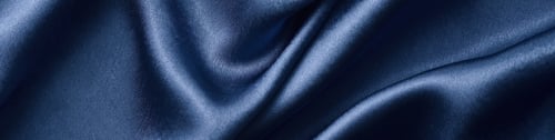 Preview: Silver silk background with a folds. Abstract texture of rippled silk surface, wide long banner