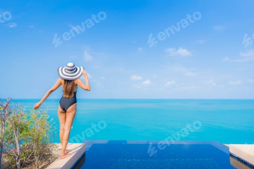 Preview: Portrait beautiful young asian woman relax smile leisure around outdoor swimming pool