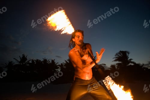 Preview: Man spinning a fiery baton