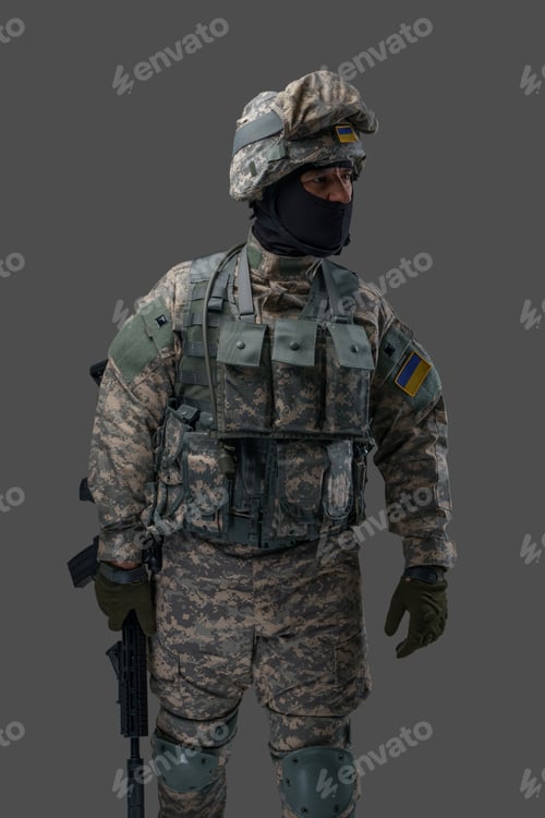 Preview: Ukrainian soldier dressed in camouflage clothes with rifle