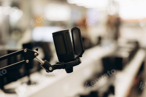 Preview: Professional Microphone on a Boom Arm in a Modern Electronics Store